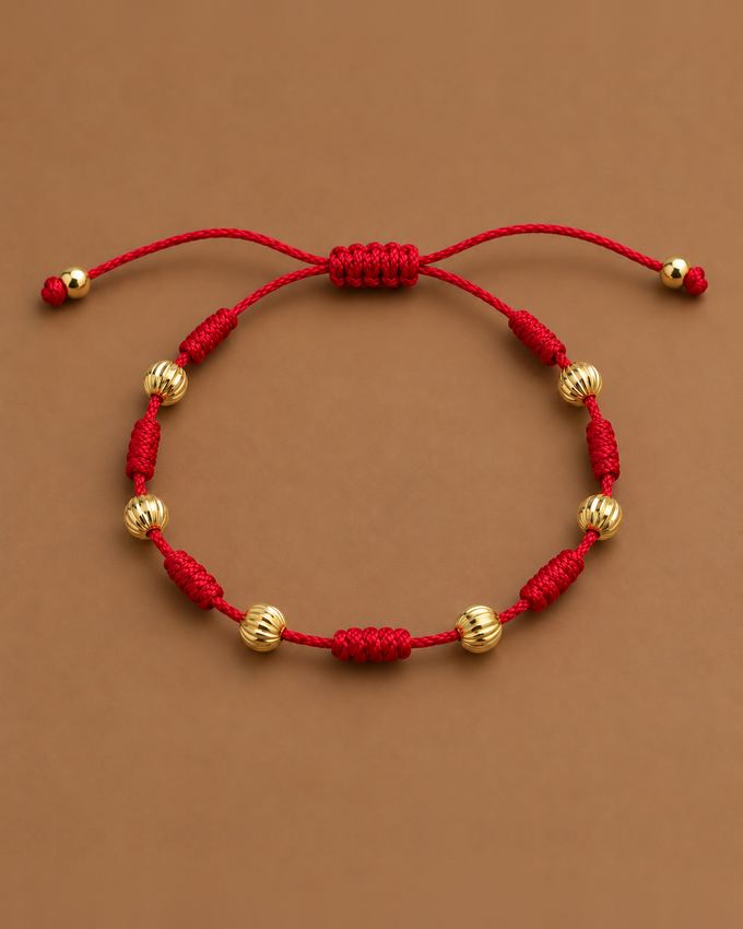 Pulsera 7 nudos roja con oro corrugado