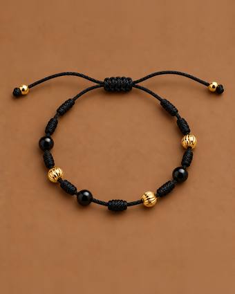 Pulsera 7 nudos negra con ónix y oro