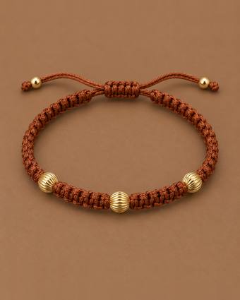 Pulsera tejida café con oro corrugado