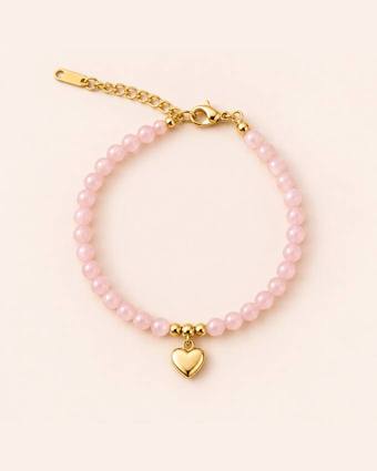 Pulsera rosa con corazón dorado