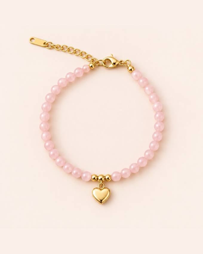 Pulsera rosa con corazón dorado