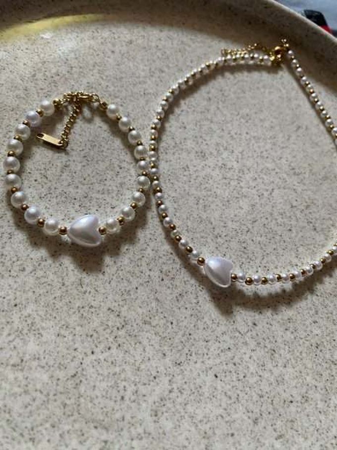 Conjunto de perlas y corazón