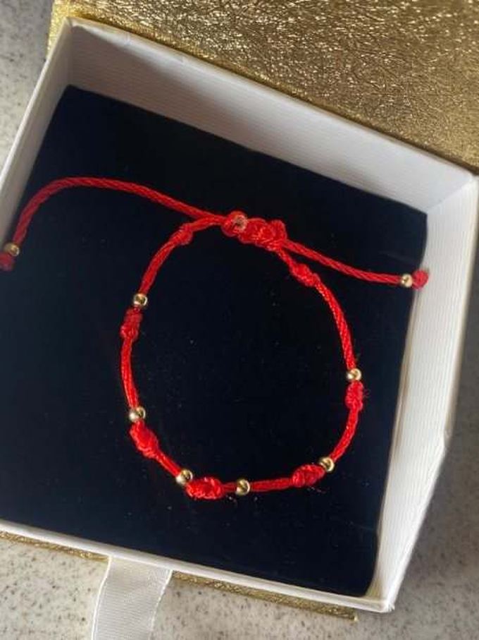 Pulsera 7 nudos roja con balines de oro 14k